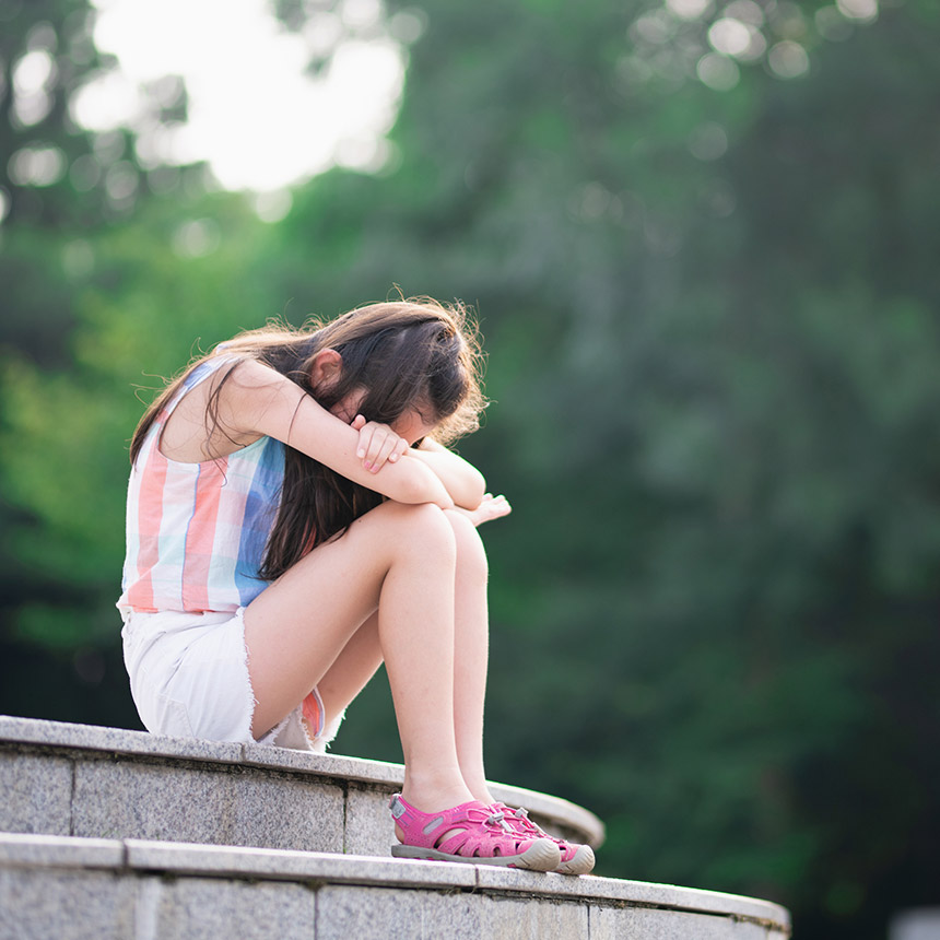 Girl sitting on stairs