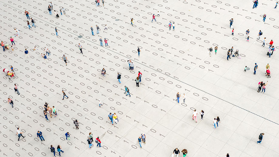 Crowd walking over binary code